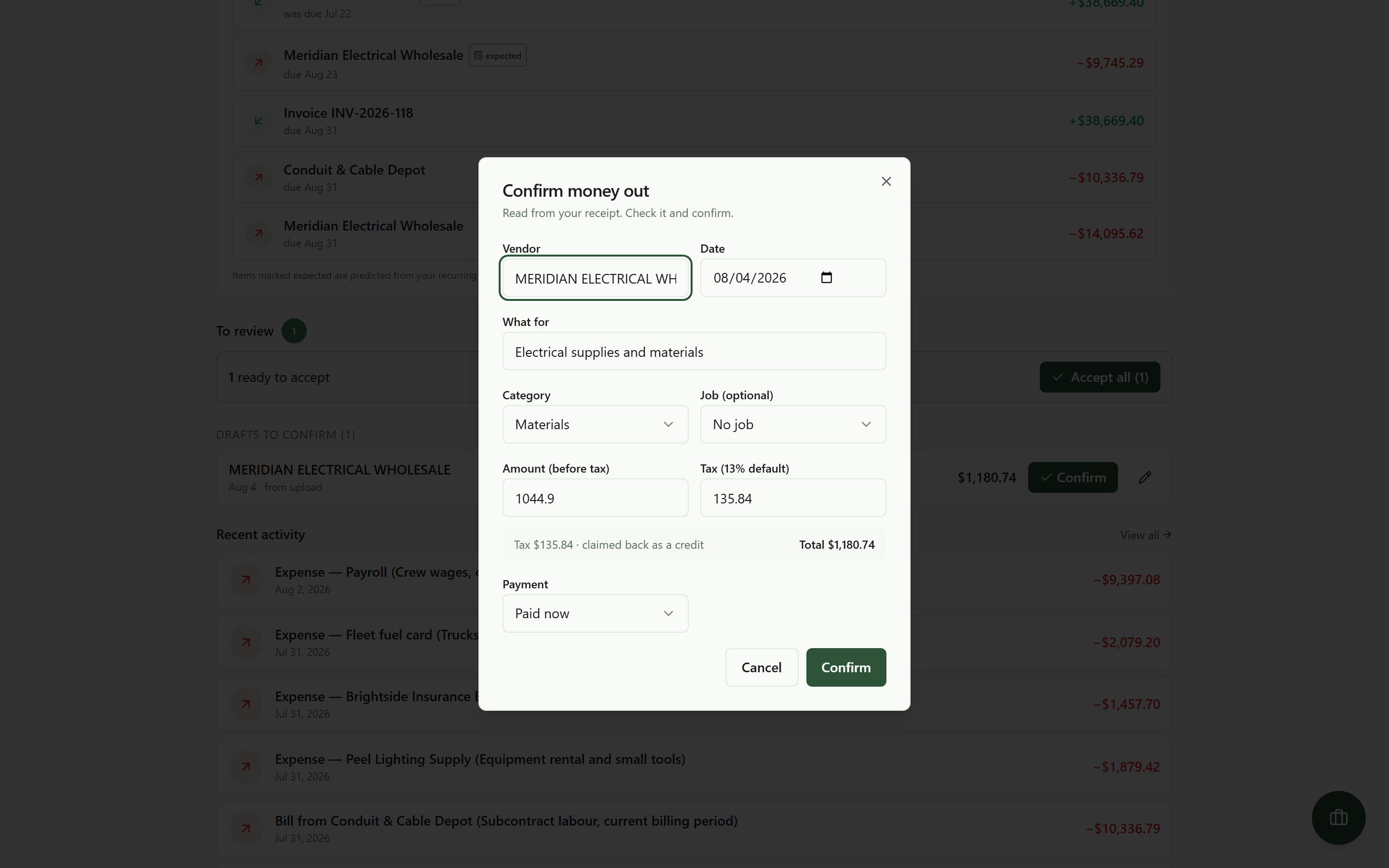 The confirm dialog for the extracted receipt, with the vendor, date, category, subtotal, tax and total already filled in from the photograph and every field editable